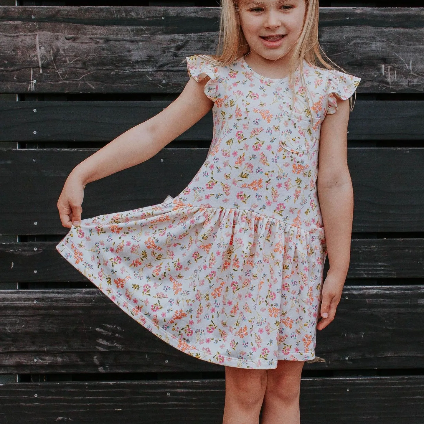 Little Girl's Ivory Floral Jersey Three Pocket Dress