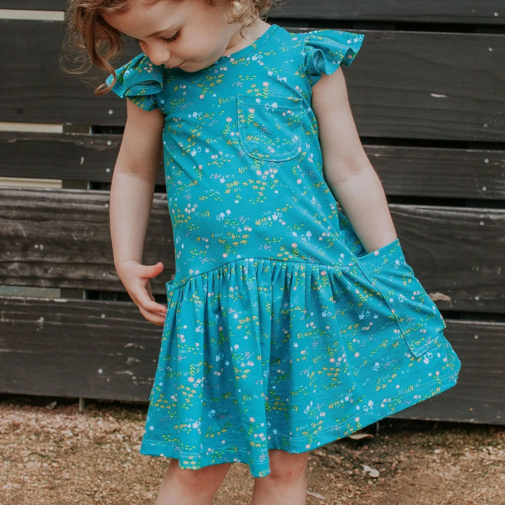 Little Girl's Turquoise Floral Jersey Three Pocket Dress